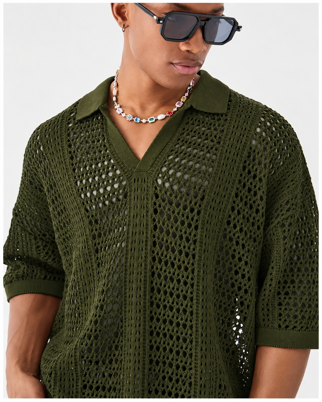 Polo de malha aberta com padrão entrelaçado