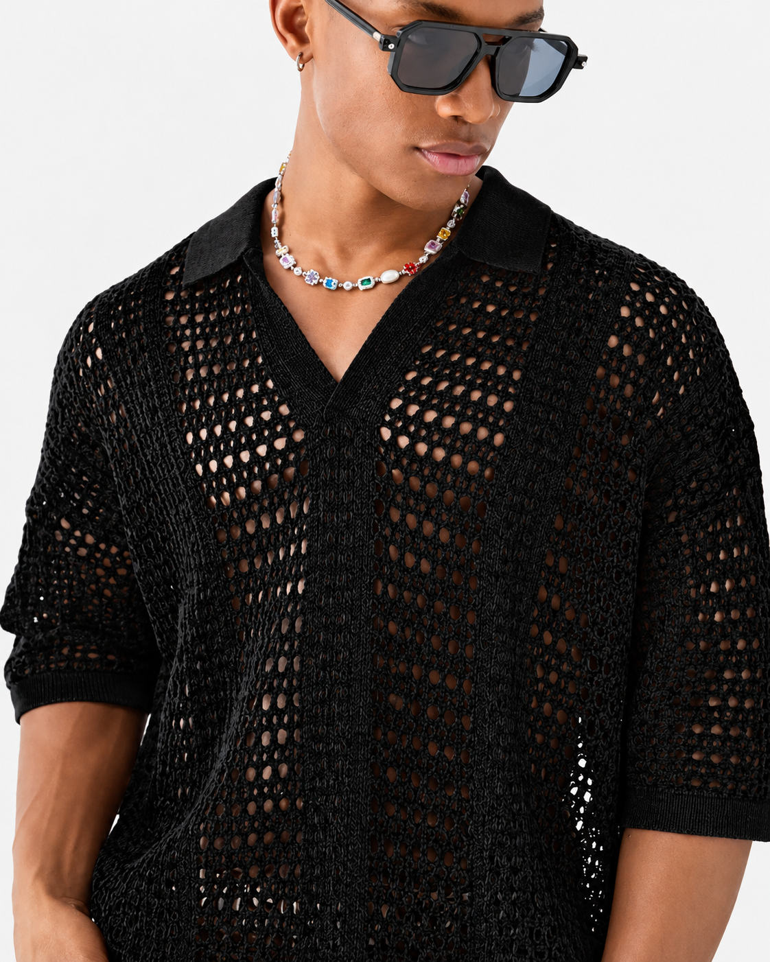 Polo de malha aberta com padrão entrelaçado