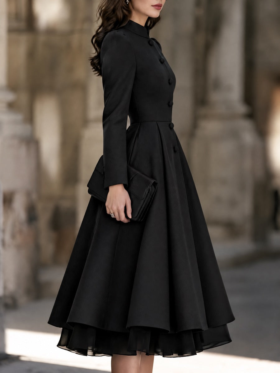 Abito Zafren nero con bottoni sul davanti e orlo in organza