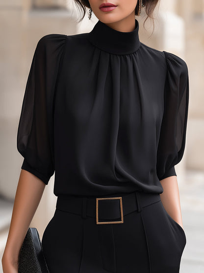Zafren zwarte chiffonblouse met pofmouwen