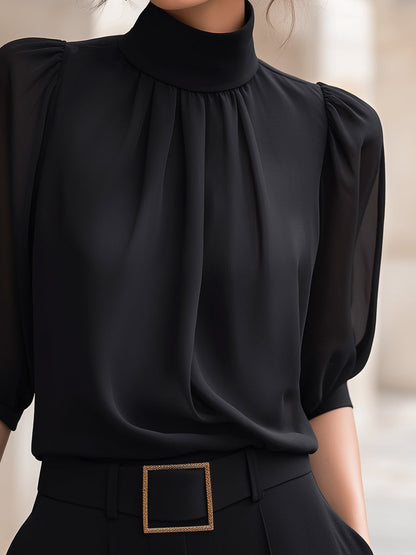 Zafren zwarte chiffonblouse met pofmouwen