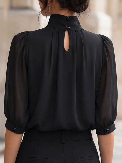 Zafren zwarte chiffonblouse met pofmouwen