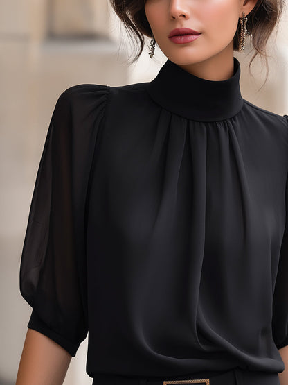 Zafren zwarte chiffonblouse met pofmouwen