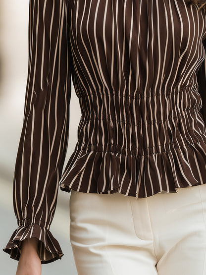Zafren brunrandig blus med smock och peplum