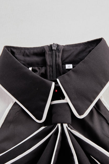Blusa Zafren com acabamento contrastante e atilhos no pescoço