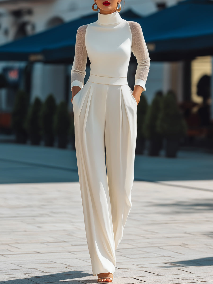 Zafren Jumpsuit in Elfenbein mit Rollkragen und transparenten Ärmeln