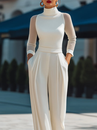 Zafren Jumpsuit in Elfenbein mit Rollkragen und transparenten Ärmeln