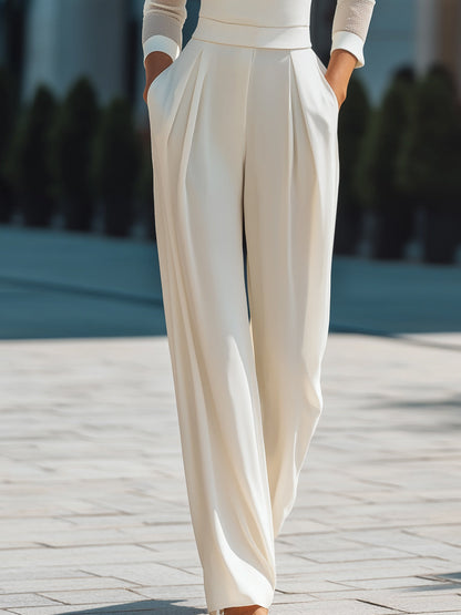 Zafren Jumpsuit in Elfenbein mit Rollkragen und transparenten Ärmeln